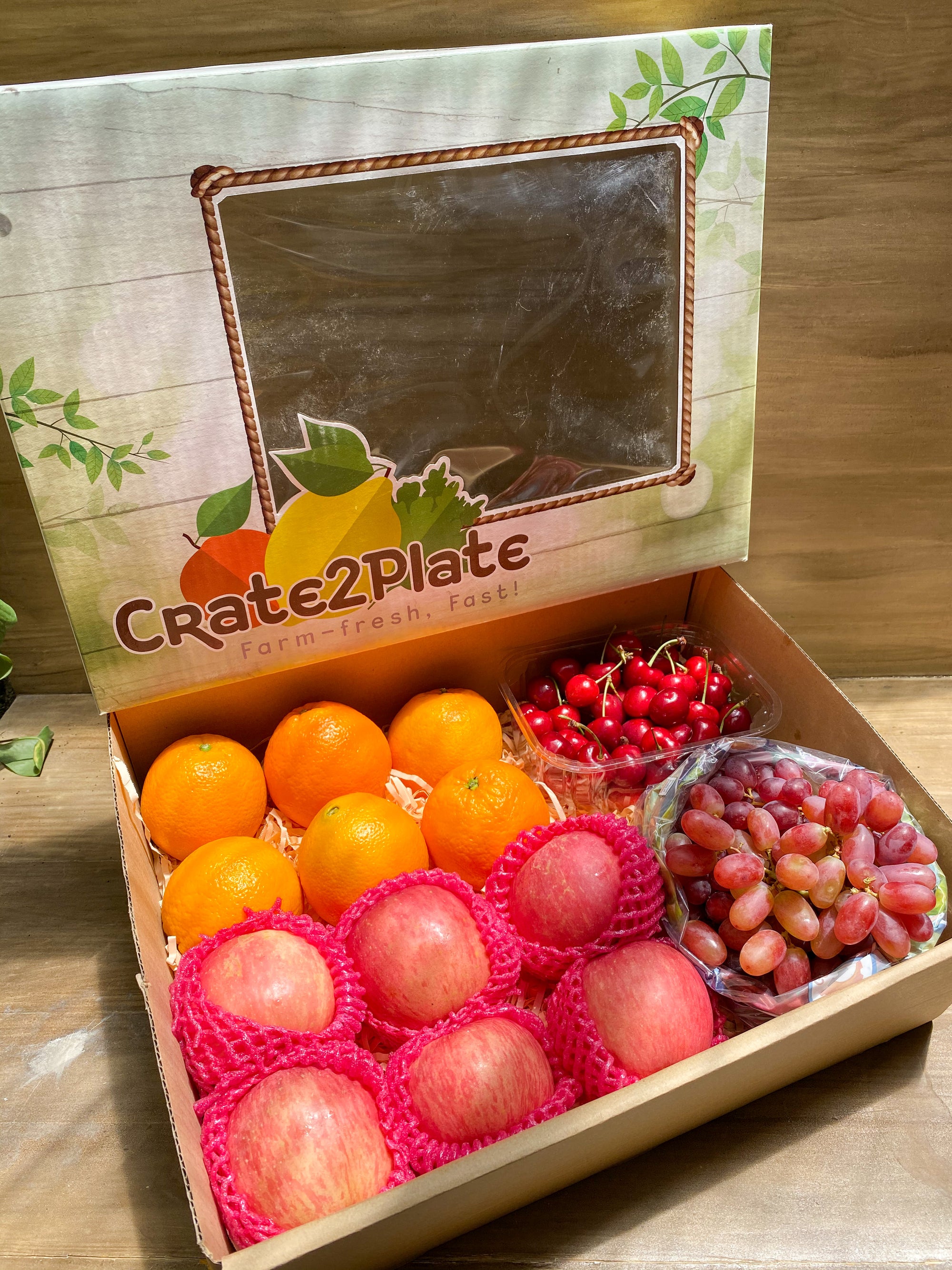 Gift Box US Cherries (half kg), Oranges, Fuji Apples and Grapes